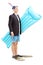 Man with suit carrying swimming mattress