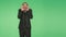 Man in a suit on a green background. body language. fright. hromakey