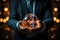 A man in a suit holding a glowing globe in his hands