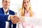 Man in suit shake hand as hello in office closeup