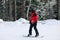 Man in suit snowboarding on hill.