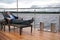 Man in suit, who rests in chaise lounge on wharf