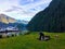 A man on summer boating trip, walking his dog and playing horseshoes, in the beautiful remote location of Indian Arm