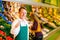 Man in supermarket as shop assistant