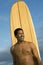 Man With Surfboard Standing Over Sky