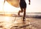 Man surfer run in ocean with surfboard. Active vacation, health