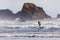 Man surfing along the Oregon coast