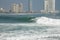 Man surfing on a wave in Iquique Chile.