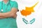 Man surgeon or doctor with stethoscope on the background of the Cyprus flag. Health care, surgery and medical concept in Cyprus