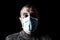 Man with surgical mask. Pandemic or epidemic and scary, fear or danger concept. Protection for biohazard like COVID-19 aka