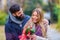 Man Surprises woman With Flowers in the park