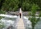 Man on a suspension bridge