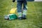 Man sweeping fallen dried autumn leaves 3