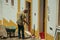 Man sweeping the front of house in street of Evoramonte