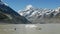 A man swim in the lake at Mount Cook