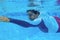 Man swimming in blue water. Swimming man underwater photo. Swimming pool training for slimmering body