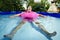 Man swimming in a portable swimming pool