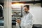 Man with tablet working at polymer factory