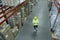 Man with tablet working at warehouse, above view. Logistics center