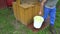 Man take bucket full of water from rustic well in garden. 4K