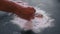 Man takes fish in flour from the table in his hand. Cooking fish. Hands close up.