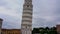 Man takes a photo with mobile of the leaning Tower of Pisa