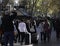 A man takes a picture of a family in las Ramblas of Barcelona