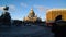 A man takes a picture of the sights of St. Petersburg: St. Isaac`s Cathedral and monument to Nicholas the First on a Sunny day