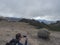 Man takes picture of view from Roque Nublo plateau in inland central mountains from famoust Gran Canaria hiking trail