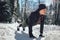 Man Taking Break From Running in Extreme Snow Conditions