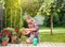 Man taking care of plants in garden