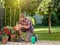 Man taking care of plants in garden