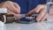 Man Taking Colorful Pills from Cellphone Screen Surface