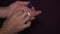 Man taking contact lens from storage case, visual impairment. Close-up of hands.