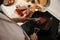 Man taking cooked meat from frying pan, above view