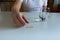 Man taking food supplements with glass of water