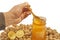 Man taking honey from a jar, walnuts and lemon