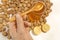 Man taking honey from a jar, walnuts and lemon