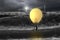 Man taking lamp balloon with dramatic ocean, lightning and light