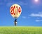 Man taking lamp balloon floating over meadow and looking at