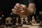 Man taking next step on chess game. Human hand moving wooden white chess king