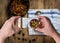 Man taking photo Chili corn carne on wood table