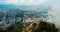 Man taking photo of Hong Kong cityscape from the Lion rock