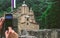 Man taking a photo of a Serbian ortodox monastery Ravanica, built in 14th century