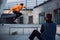 man taking photo of skateboarder jumping