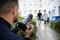 Man Taking Photograph Of Couple Walking Together At Outdoors