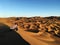 Man taking photos of Sand dunes in desert