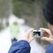 Man taking picture for his girlfriend. Conceptual image shot