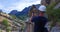 Man taking a picture in Royal Trail El Caminito del Rey in gorge Chorro, Malaga province, Spain