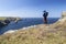 The man is taking pictures. Beautiful oceanfront landscape in Cornwall, Boscastle